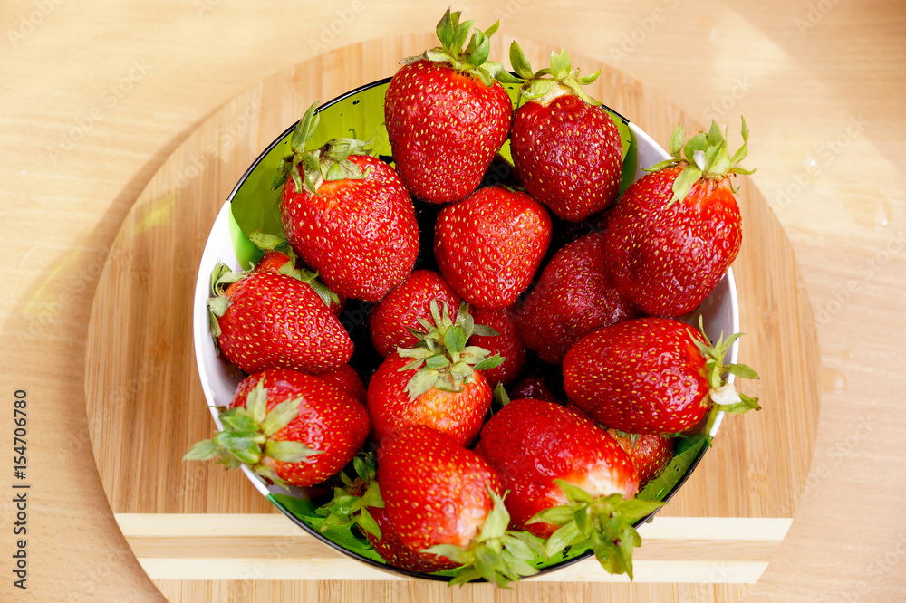 Bright fresh strawberry in a round container Bright fresh strawberry in a round container