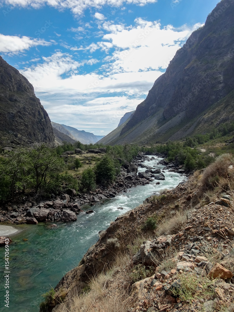 landscape of river in wild nature with mountains at horizon landscape of river in wild nature with mountains at horizon