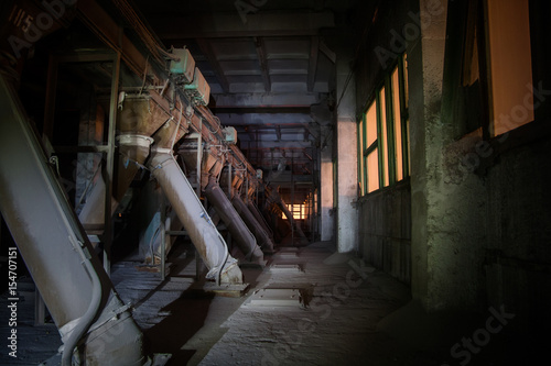Old abandoned silo elevator with rusty equipment left © Mulderphoto