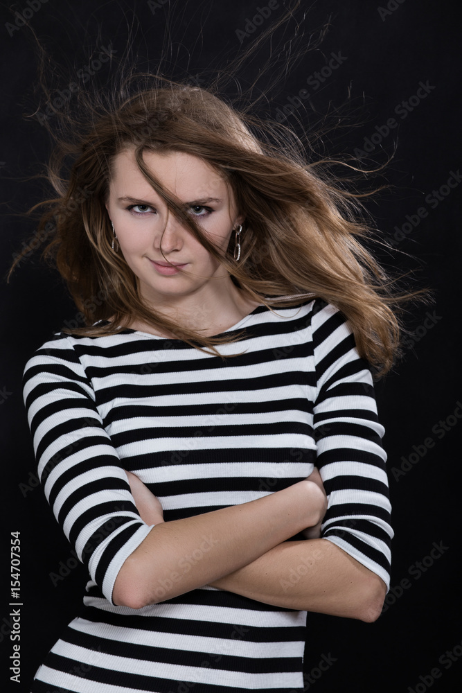 beautiful woman with flying long hair on black background beautiful woman with flying long hair on black background
