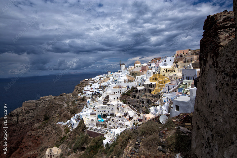 Landscape of famous Greek village Oia at Santorin Island with view to the caldera 