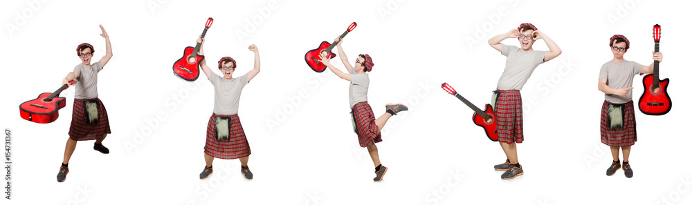 Scotsman playing guitar isolated on white Scotsman playing guitar isolated on white