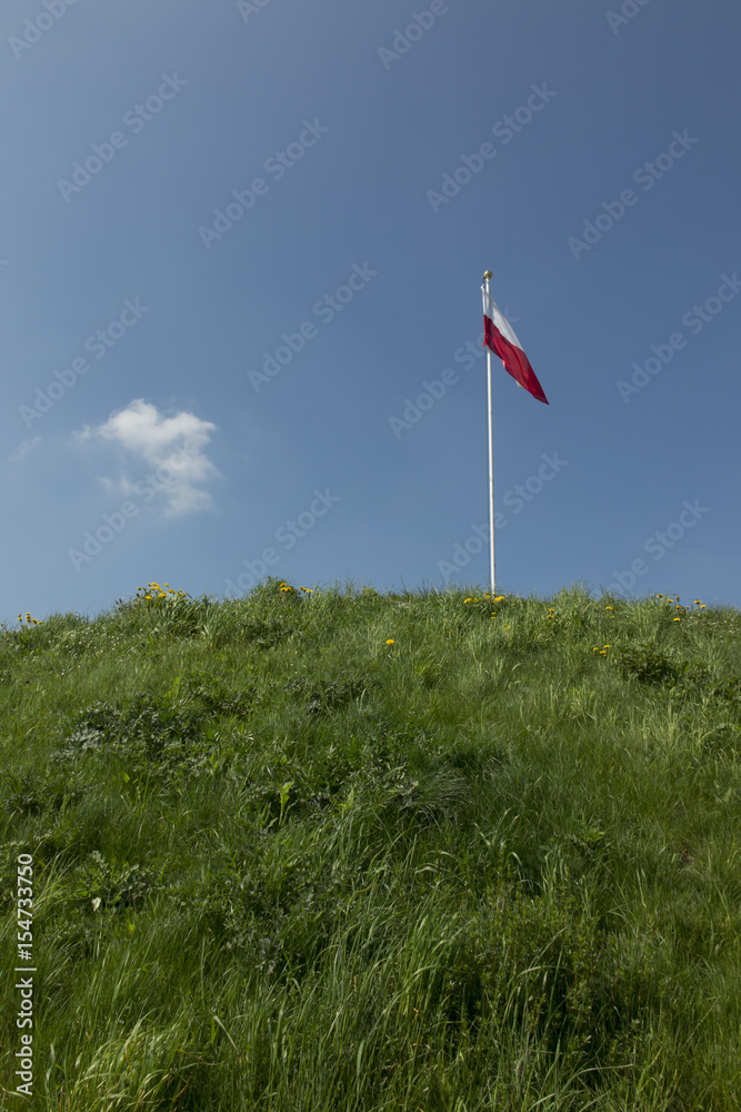 Polish national flag at the summit of liberation mound