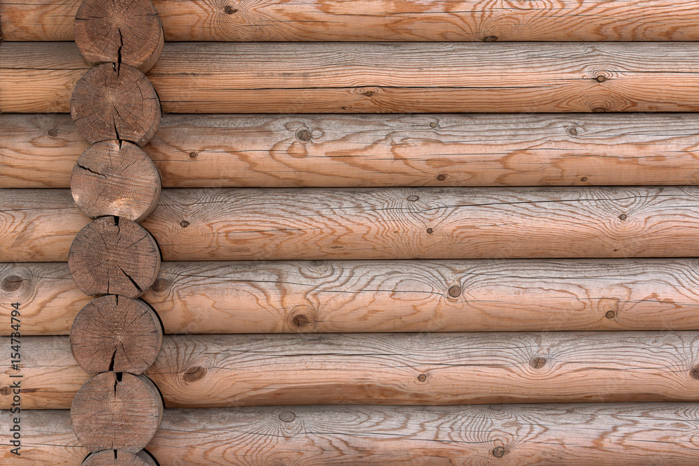 The wall of a wooden house from calibrated logs The wall of a wooden house from calibrated logs