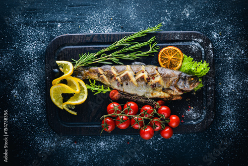 Photography Trout fish baked with aromatic herbs and spices