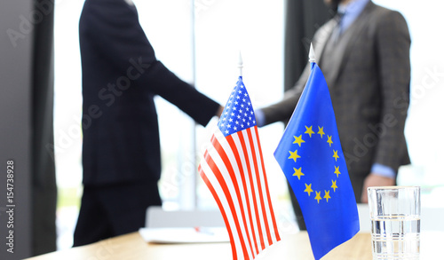 European Union and American leaders shaking hands on a deal agreement. photo