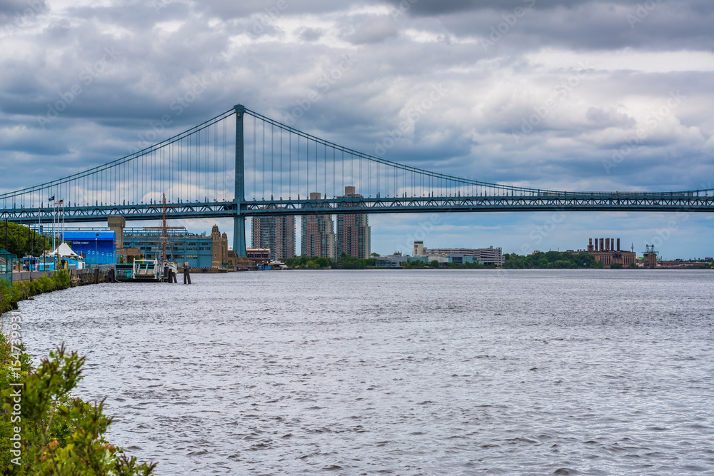 The Delaware River and Ben Franklin Bridge, seen from Penn's Landing in Philadelphia, Pennsylvania.