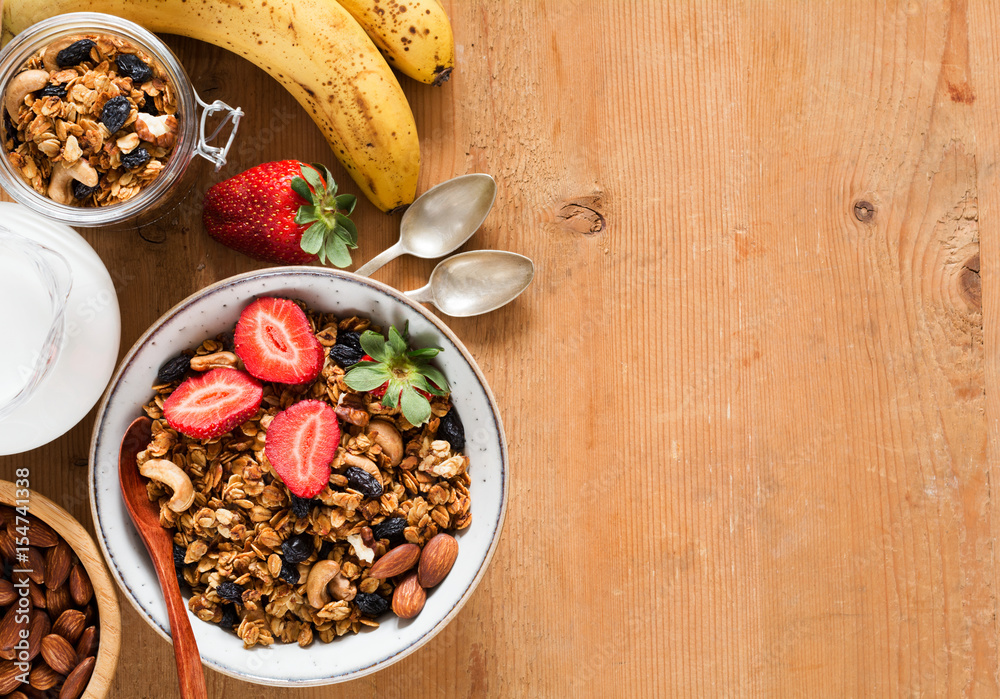 Granola, muesli, breakfast cereals, fresh fruits and milk. Healthy