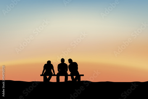 men sitting and talking at sunset