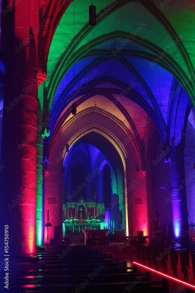 Church with romantic lighting in several colors.