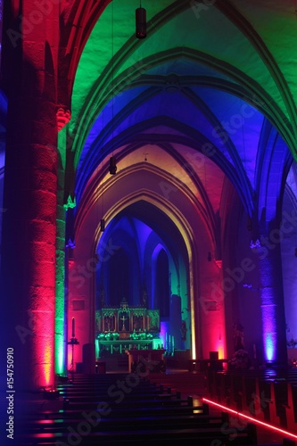 Church with romantic lighting in several colors.