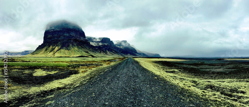 Desolate black gravel road in Southern Iceland