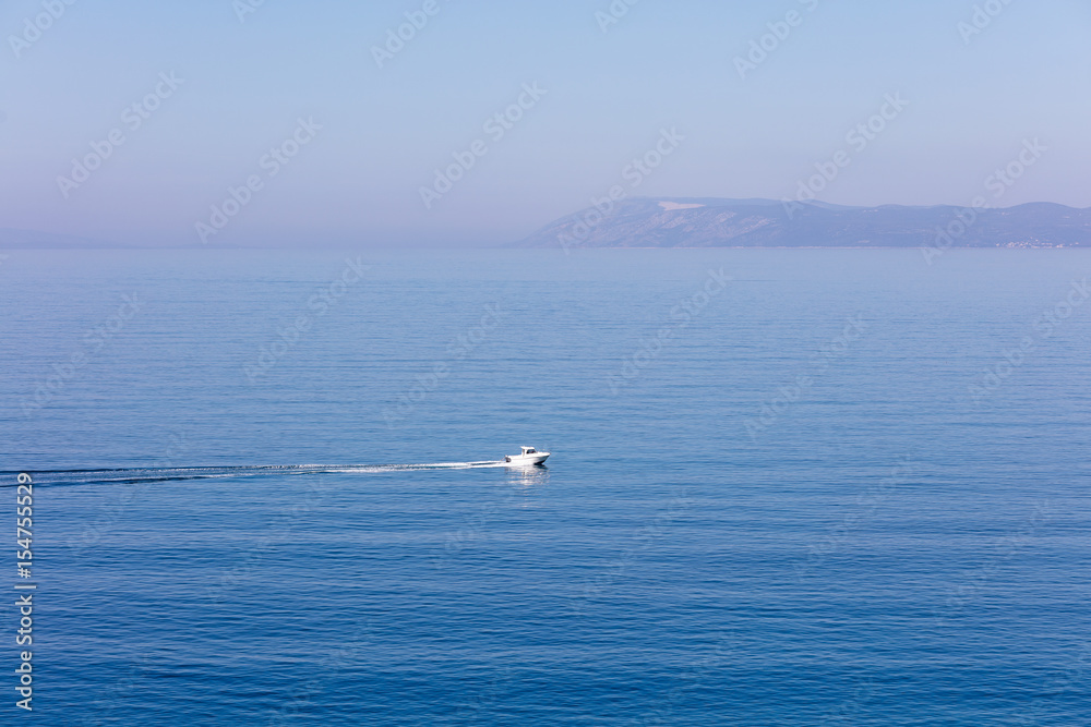 Aerial view of small boat flowing in sea, travel and vacation concept