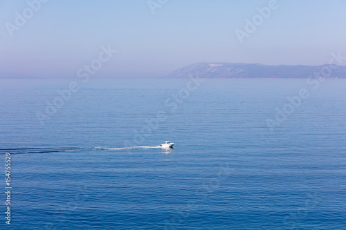 Aerial view of small boat flowing in sea, travel and vacation concept