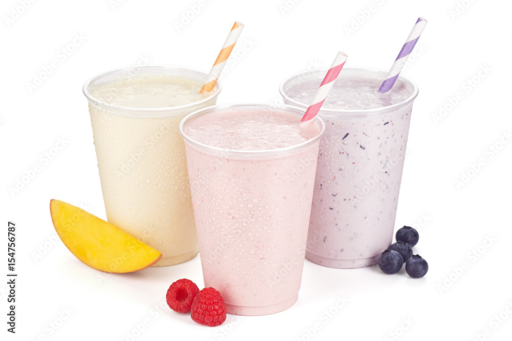 Three Flavors of Fruit and Yogurt Smoothies or Shakes on White Three Flavors of Fruit and Yogurt Smoothies or Shakes on White