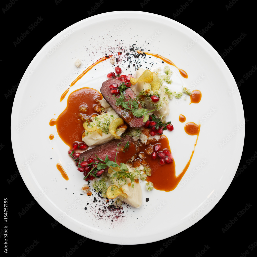 Venison fillet and potato puree isolated on black Venison fillet and potato puree isolated on black