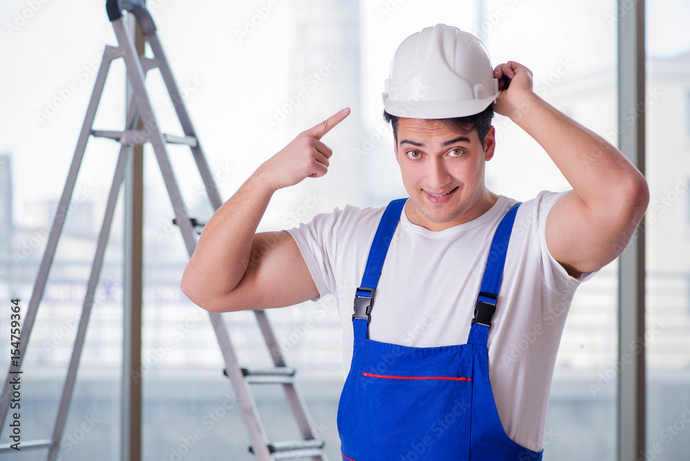 Young worker with safety helmet hardhat Young worker with safety helmet hardhat