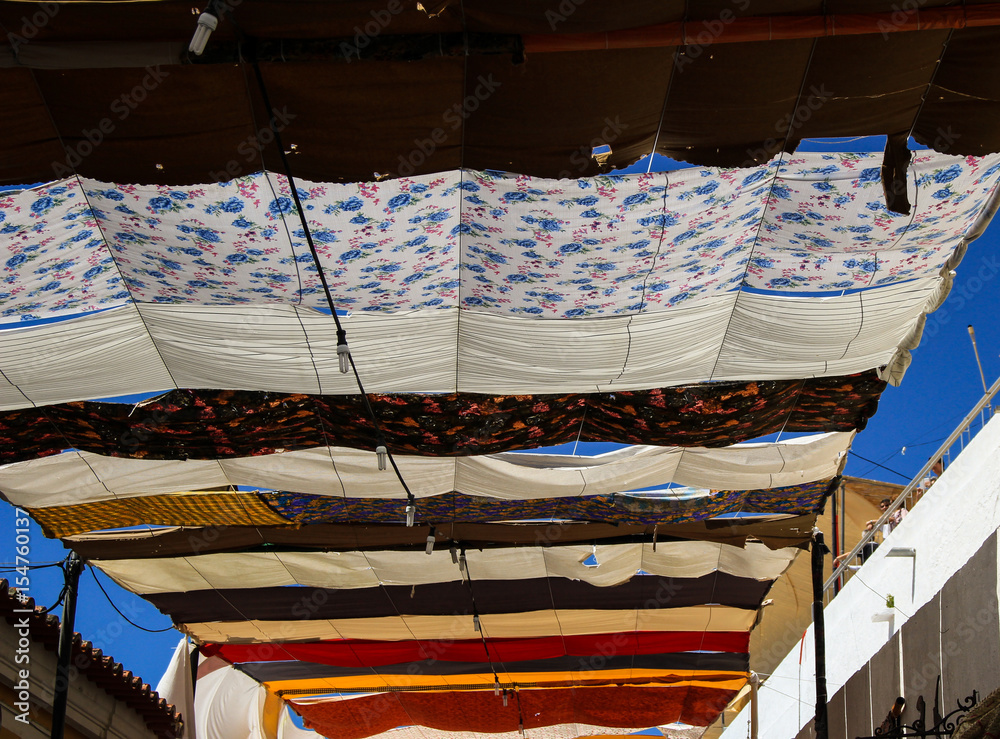 Fototapeta premium Detail from the roof made with Colorful cloths from a Islamic street market 