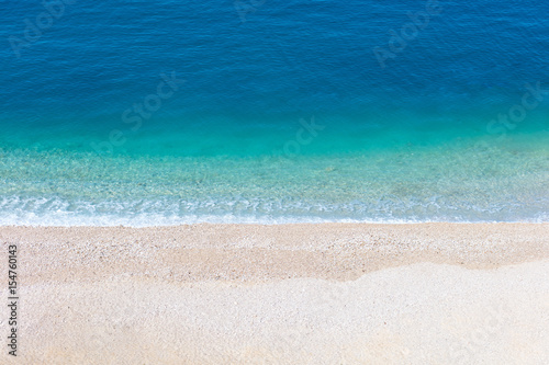 Fototapeta Naklejka Na Ścianę i Meble -  Top aerial view of empty beauty beach in Italy, Europe