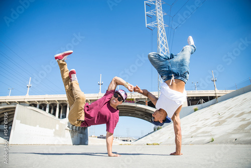 Breakdancers performing tricks photo