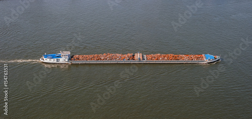 Waste disposal on cargo ship. Boat and scrap metal
