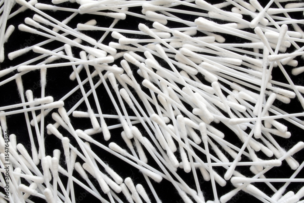 Fototapeta premium Cotton Ear Cleaning Buds On Black Background 