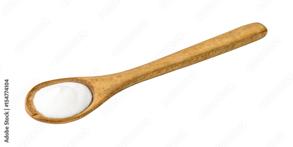 White Yogurt on Wooden Spoon Isolated on White Background White Yogurt on Wooden Spoon Isolated on White Background