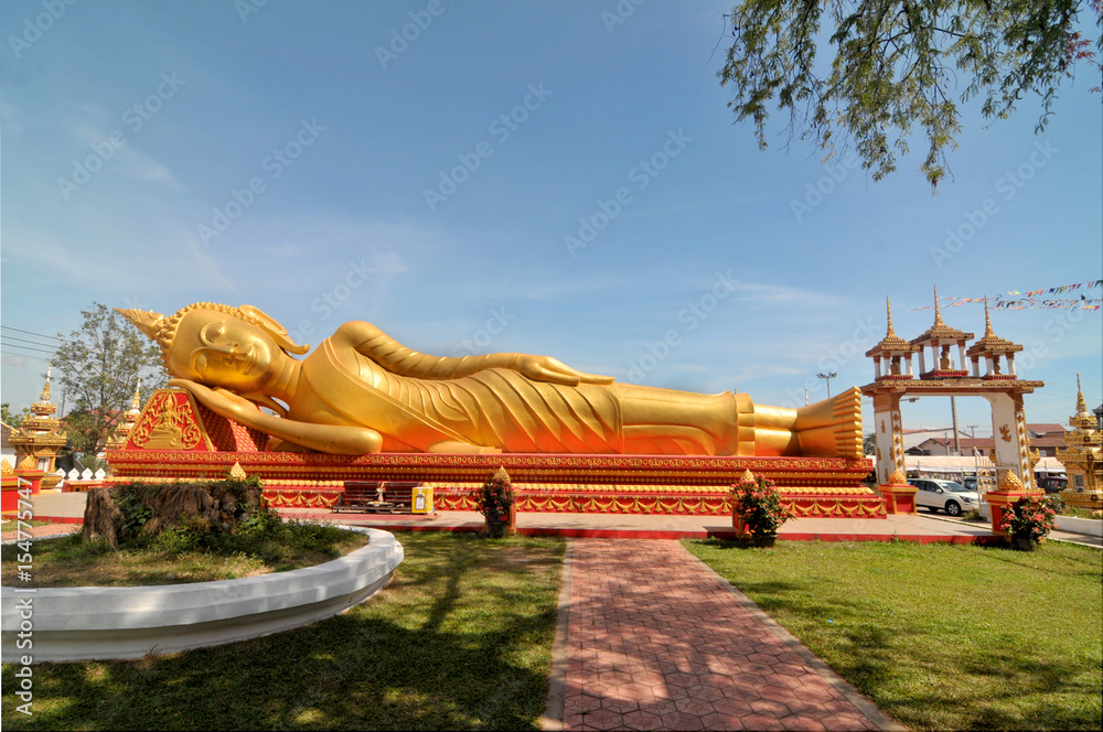 Buddhist  temple  Pha That Luang with Lying Buddha  in Vientiane in Laos
