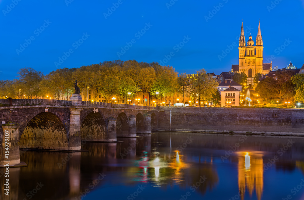 Night view of Angers with Verdun Bridge and Saint Maurice Cathedral - France