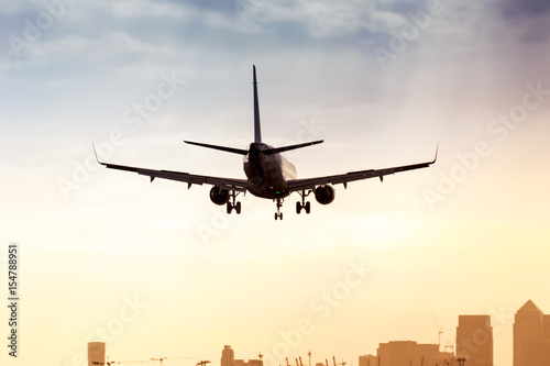 Plane landing, sunset at London City Airport