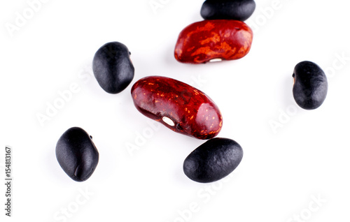 Close up black beans isolated on white background photo