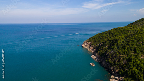 Aerial view of tropical island clear blue sea © Nopporn