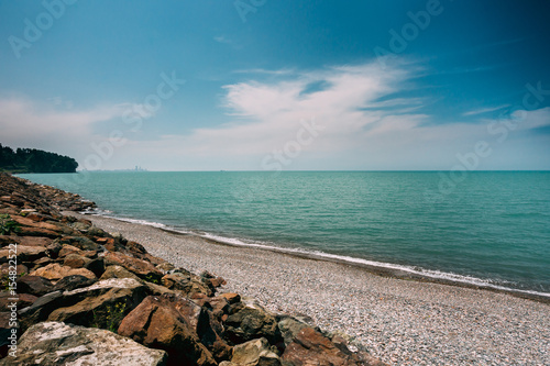 Sunny Sky Over Calm Water Of Sea Or Ocean. Natural Landscape Wit