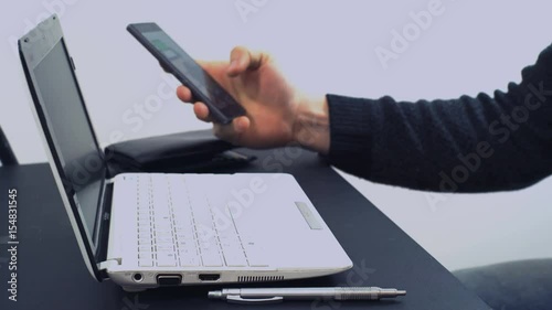 A Man Sits Behind a Laptop and Makes an Online Payment with the Help of a Credit Card