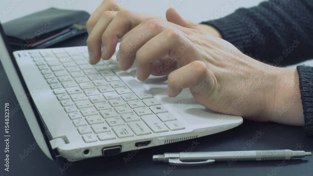 Worker Office Man Work On Laptop, Use Keyboard and Make an Online Purchase Payment Worker Office Man Work On Laptop, Use Keyboard and Make an Online Purchase Payment