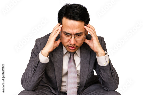 Frustrated and thinking businessman isolated on white background.