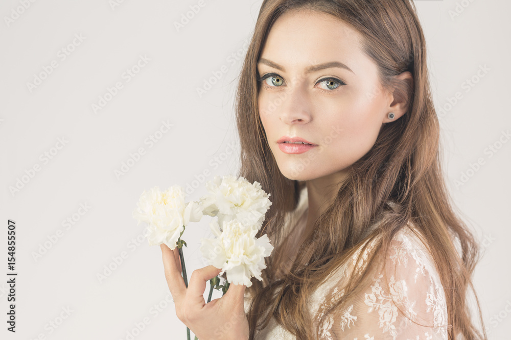 Lovely girl with bouquet of flowers