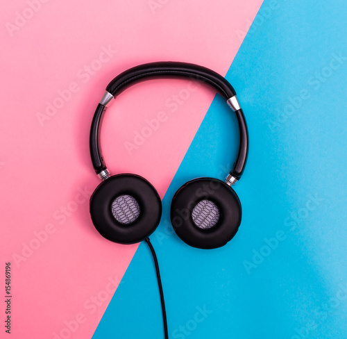 Headphones on a bright split background