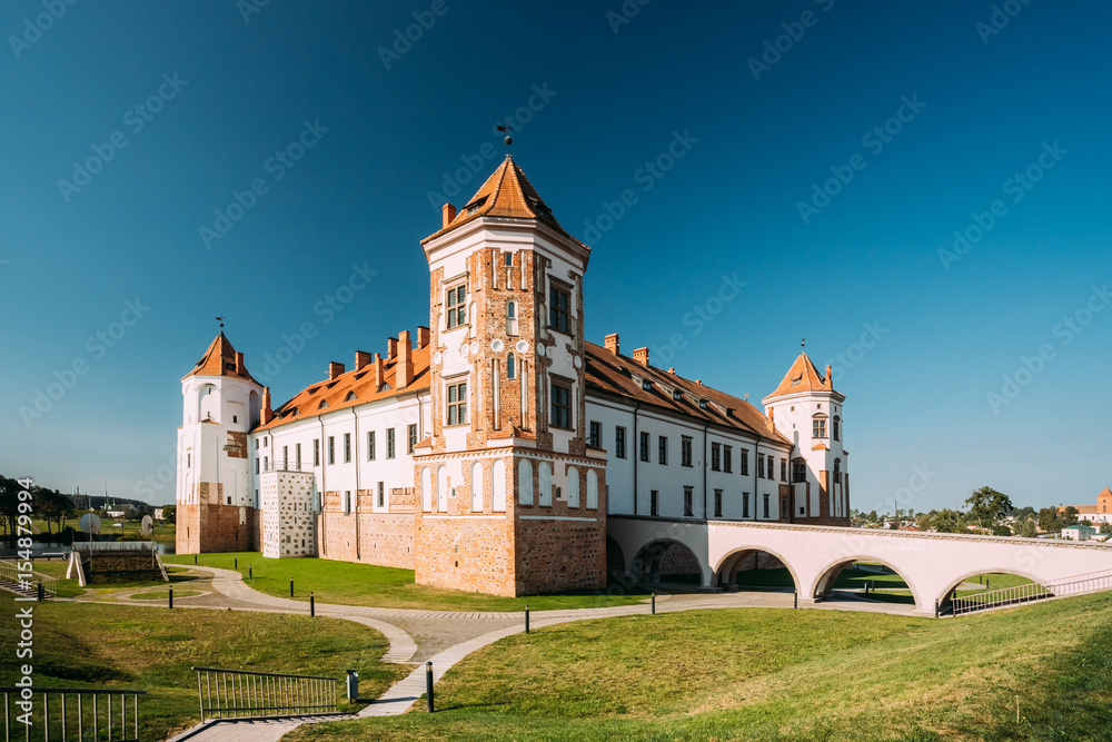 Mir, Belarus. Towers Of Mir Castle Complex On Blue Sunny Sky Background. Architectural Ensemble Of Feudalism