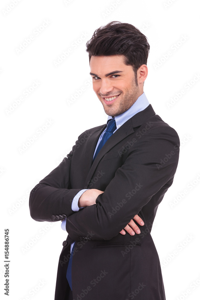 happy young business man with hands crossed smiling happy young business man with hands crossed smiling