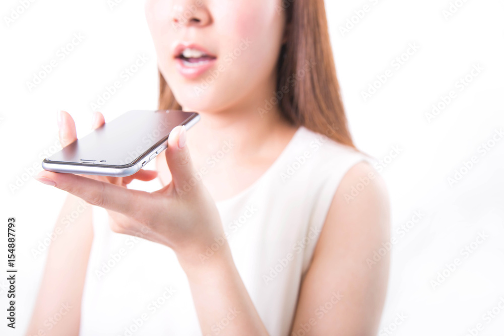 Young woman recording voice message with smartphone Young woman recording voice message with smartphone