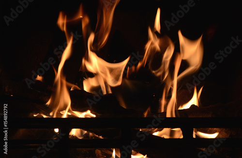 Flames with motion blur in a fireplace.