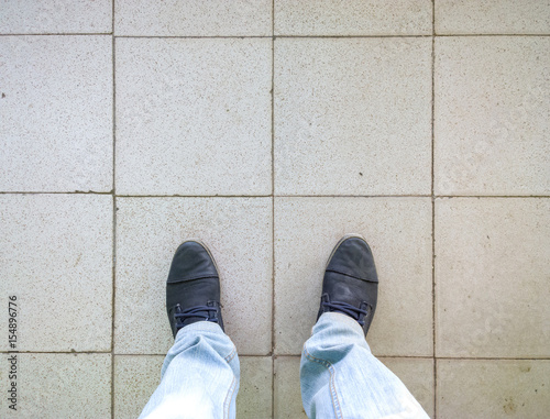 Feet on tile.