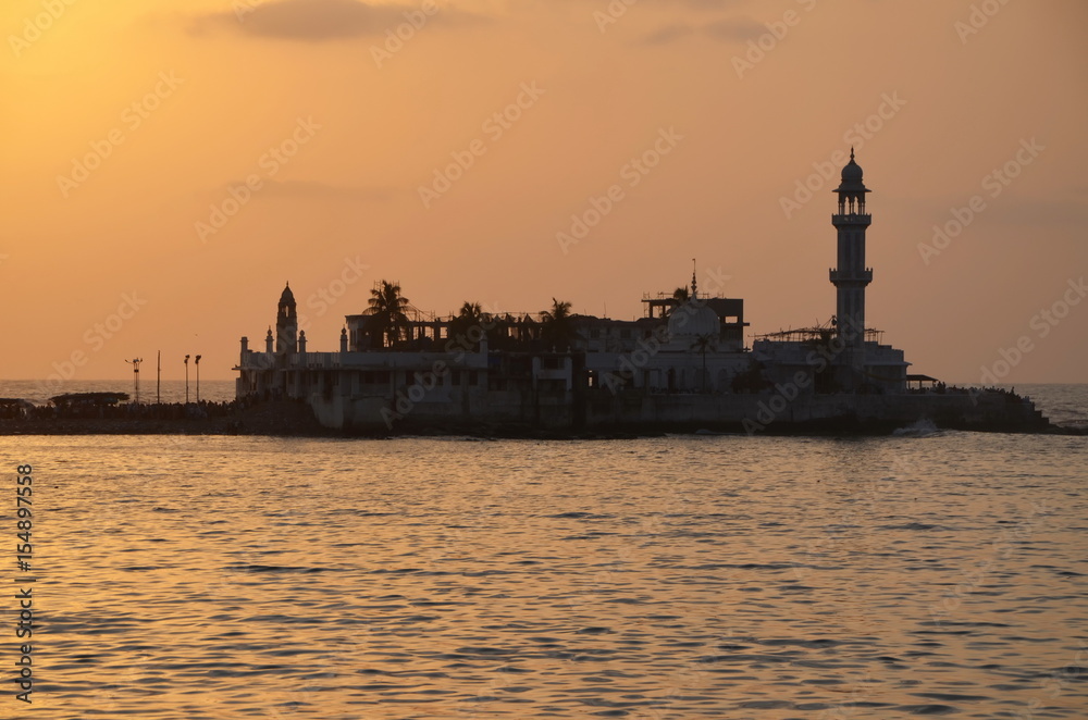 Mosque Haji Ali in Mumbai at sunset. Mosque was built in 1431 in memory of a rich Muslim merchant