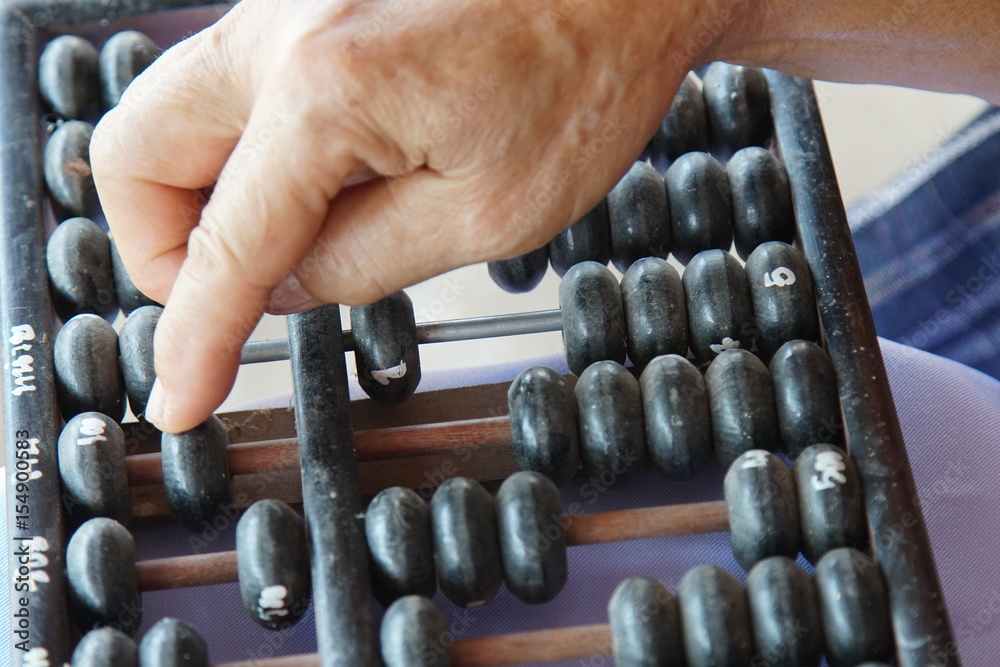 Old handle using old abacus for business Old handle using old abacus for business