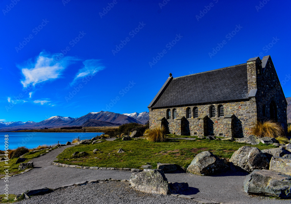 Lake church and mountains
