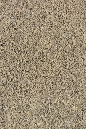 Abstract background of closeup dark uneven asphalt