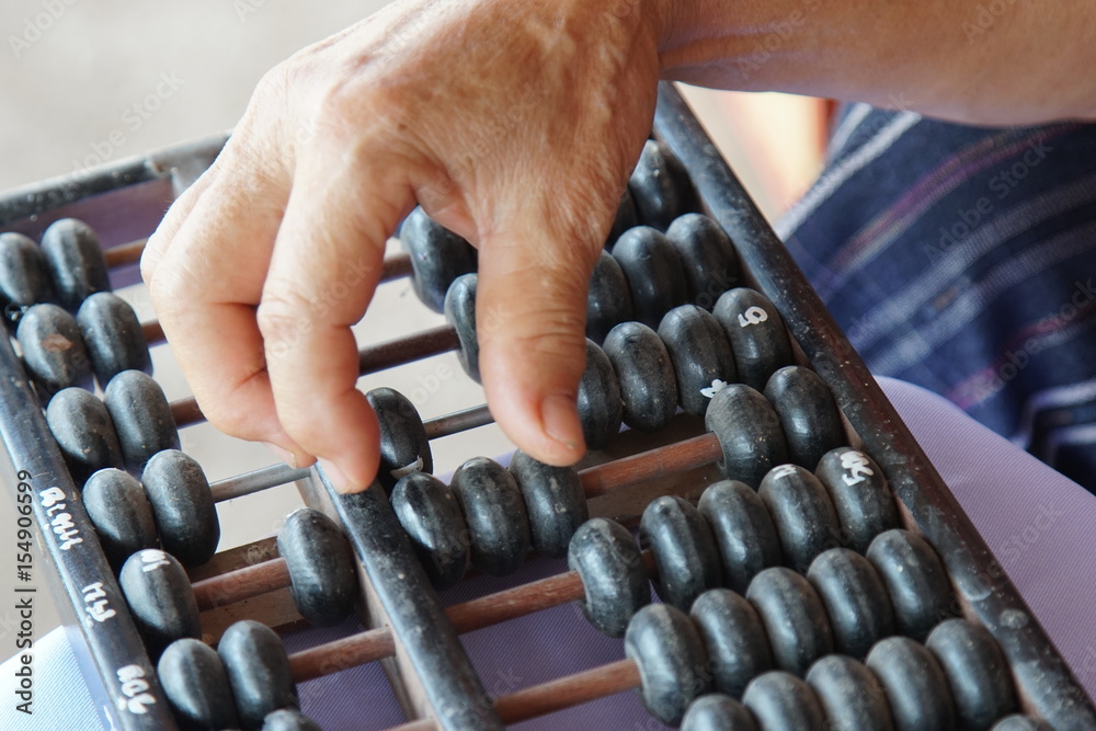 Old handle using abacus for business Old handle using abacus for business