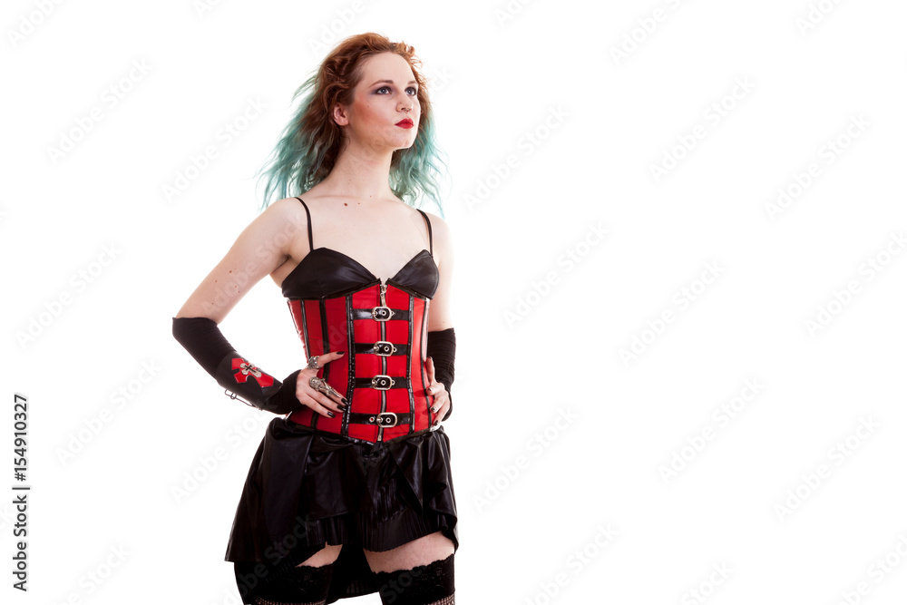 Beautiful BDSM model in leather corset isolated on white background in studio photo Beautiful BDSM model in leather corset isolated on white background in studio photo