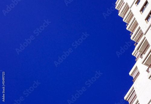 High-rise building and bright blue sky